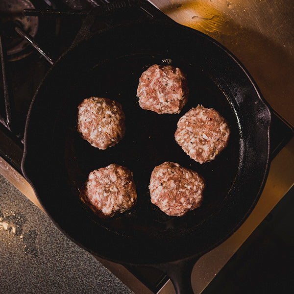 CURED Fine Meats - Sage Breakfast Sausage cooking in a skillet